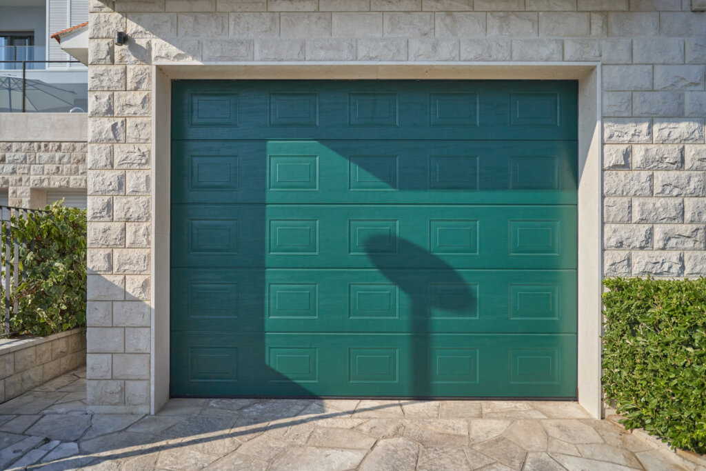 Modern teal garage door. Elegant automatic garage door.