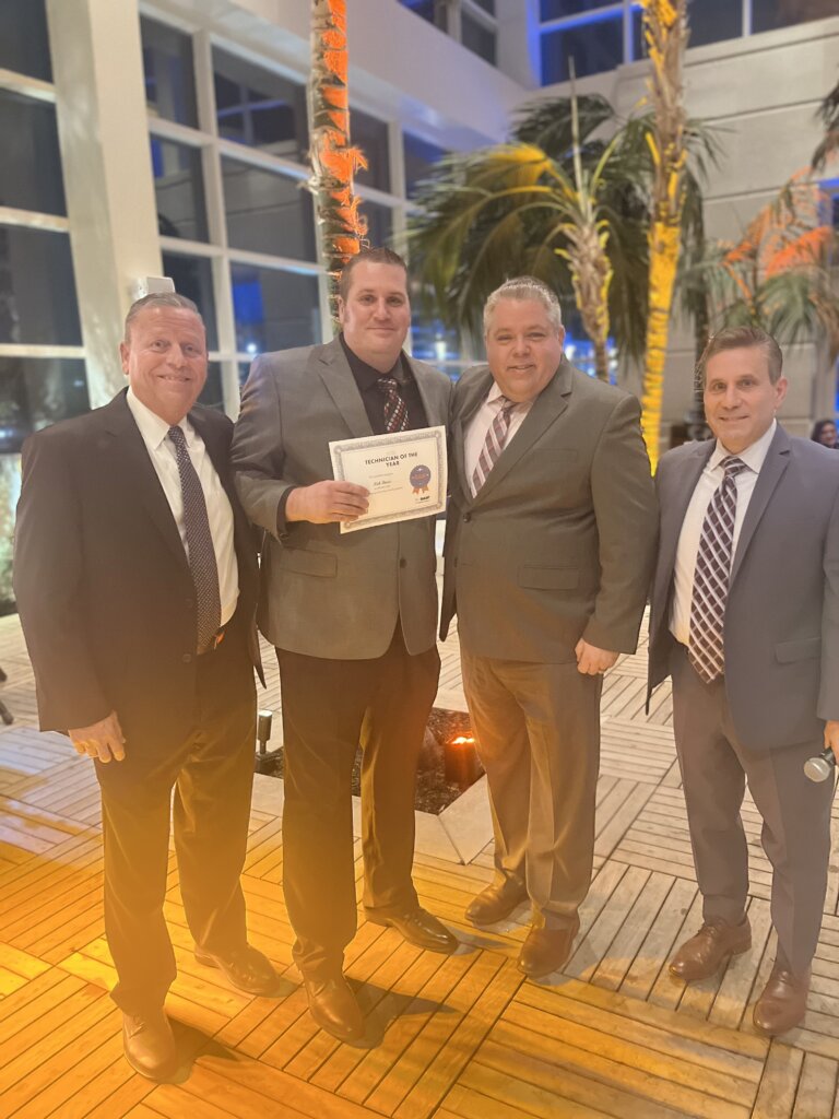 Nick accepting his award with Division Vice President, Dennis Cone, Manager Greg Barnable, and VP of Operations, Pat Porcella.