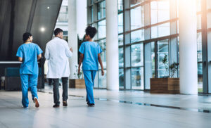 medical professionals walking through a pest free facility