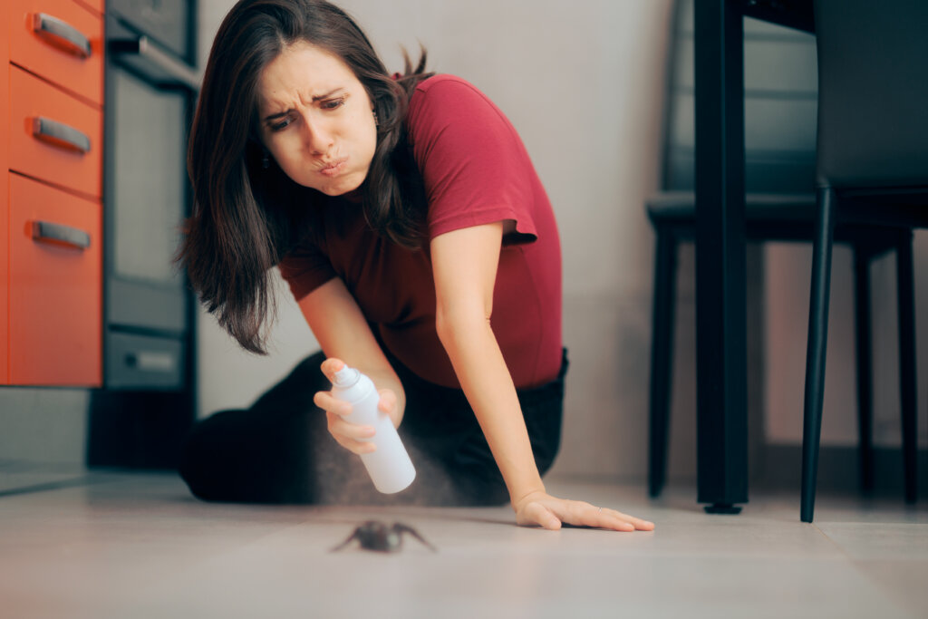Homeowner dealing with pest infestation problem in her own home